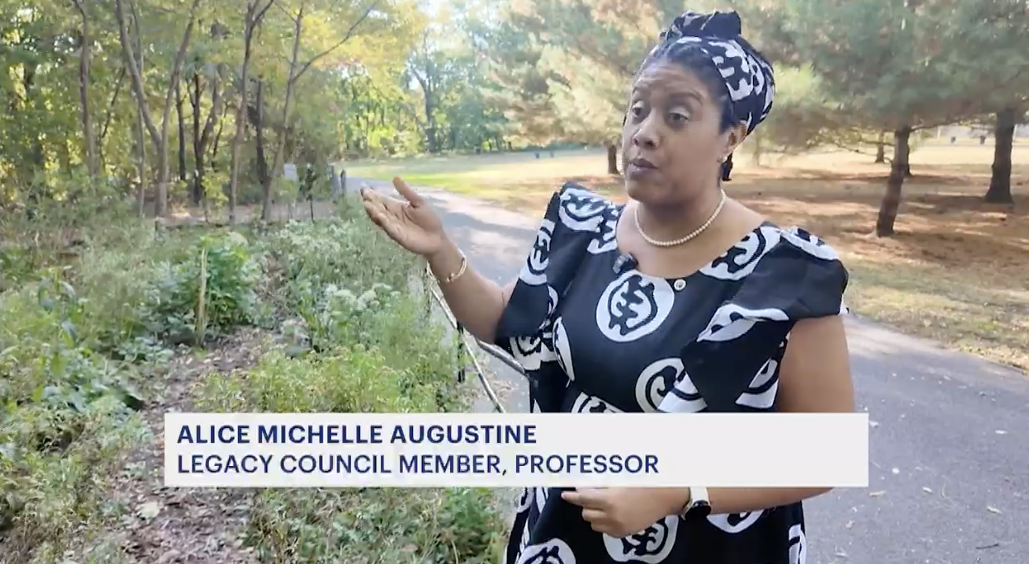 Alice Michelle Augustine speaks to an off-camera reporter at the African Burial Ground in Van Cordtlandt Park.